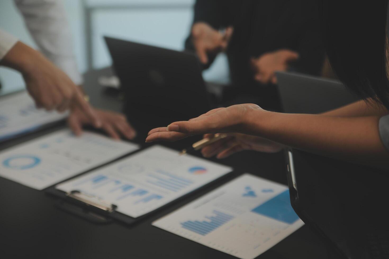 Business team collaboration discussing working analyzing with financial data and marketing growth report graph in team, presentation and brainstorming to strategy planning making profit of company. photo