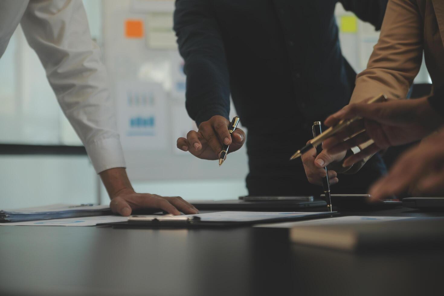 Business team collaboration discussing working analyzing with financial data and marketing growth report graph in team, presentation and brainstorming to strategy planning making profit of company. photo