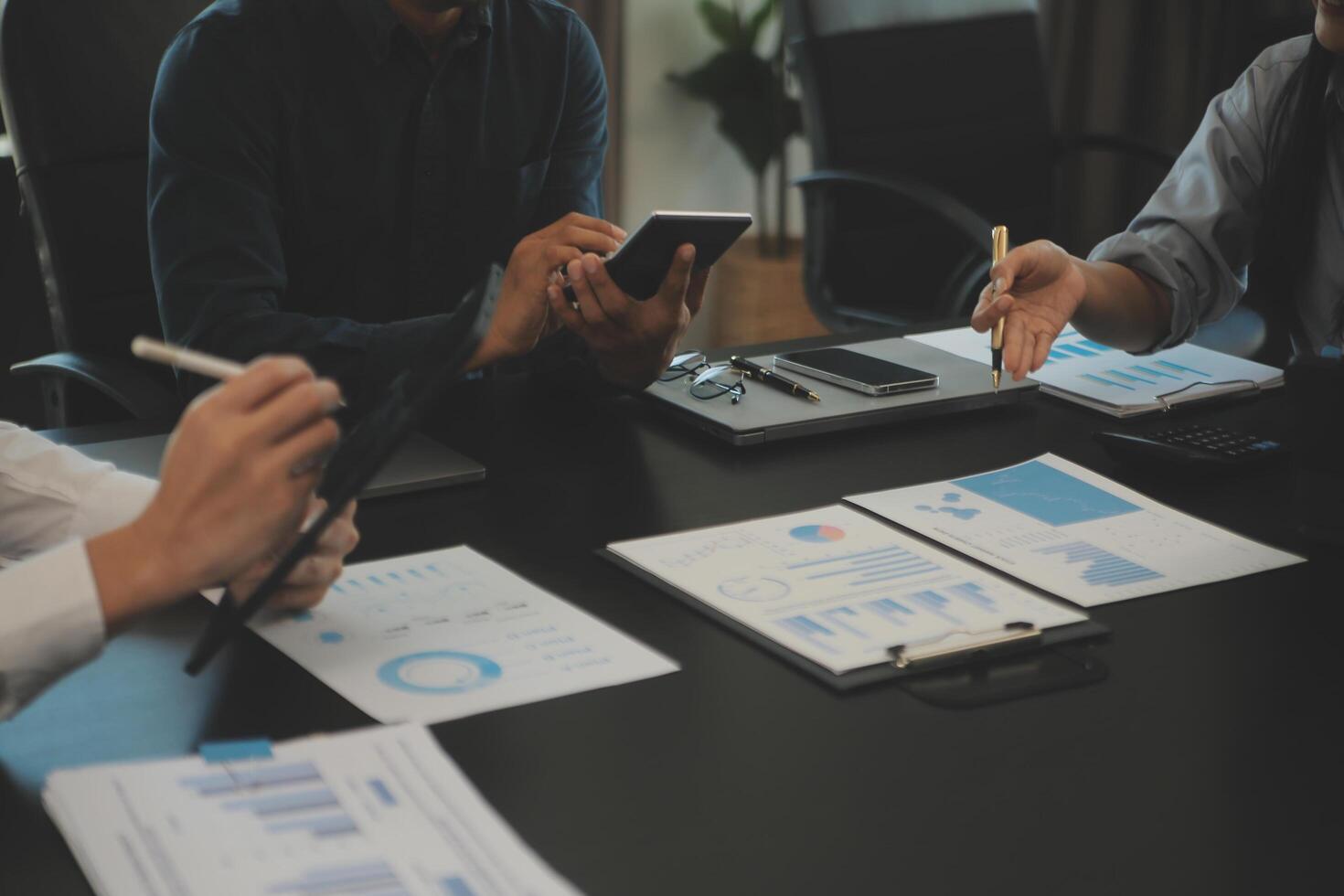 Business team collaboration discussing working analyzing with financial data and marketing growth report graph in team, presentation and brainstorming to strategy planning making profit of company. photo