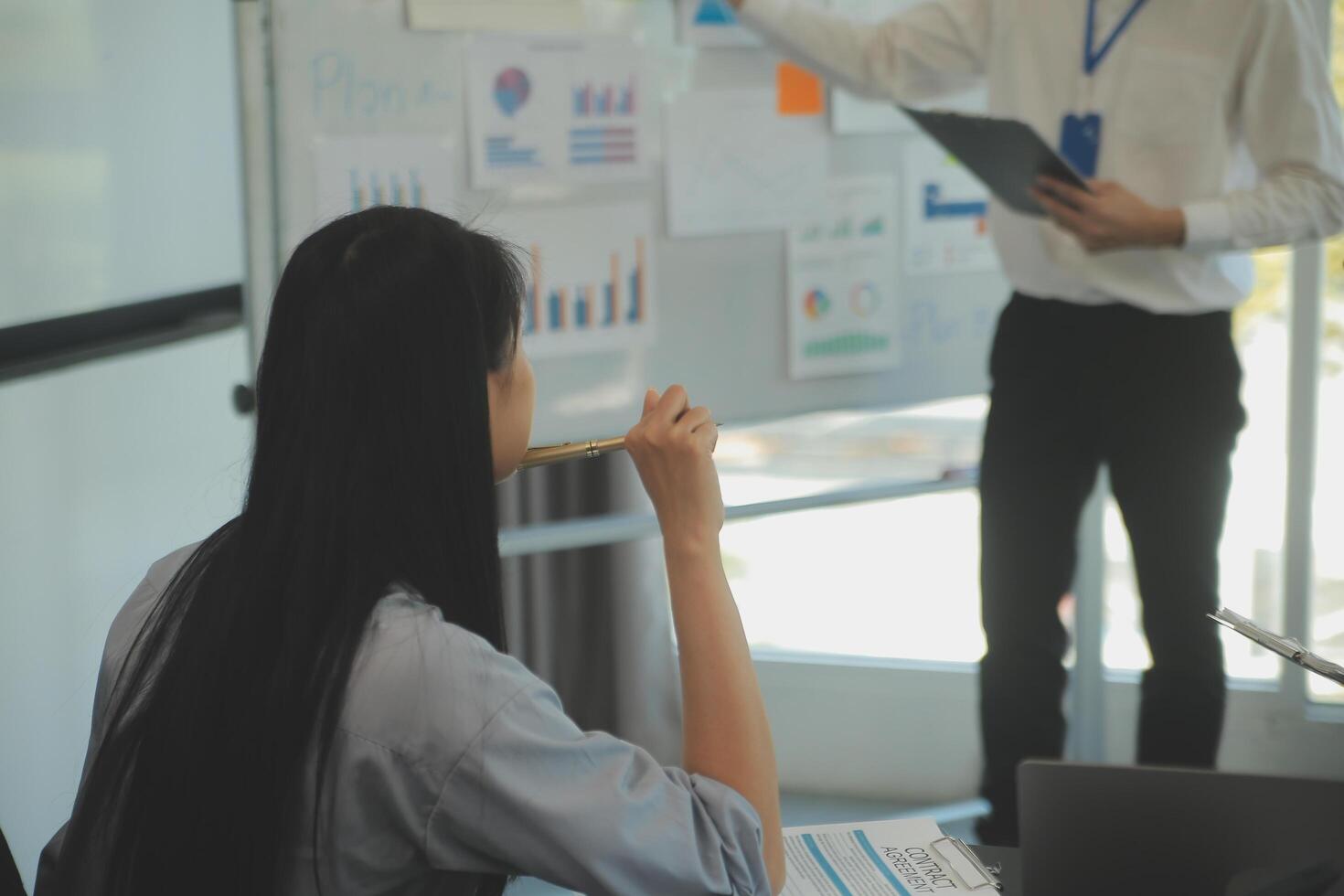 Business team collaboration discussing working analyzing with financial data and marketing growth report graph in team, presentation and brainstorming to strategy planning making profit of company. photo
