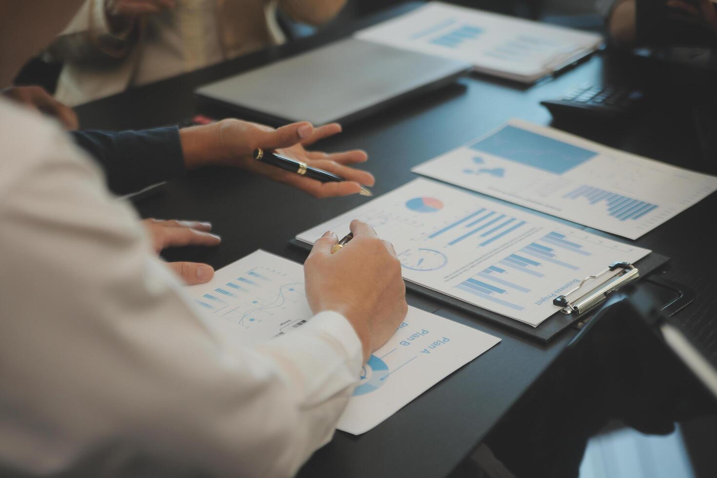 Business team collaboration discussing working analyzing with financial data and marketing growth report graph in team, presentation and brainstorming to strategy planning making profit of company. photo