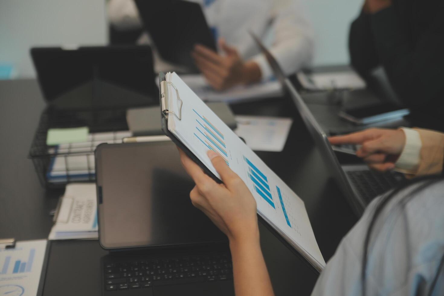 Business team collaboration discussing working analyzing with financial data and marketing growth report graph in team, presentation and brainstorming to strategy planning making profit of company. photo