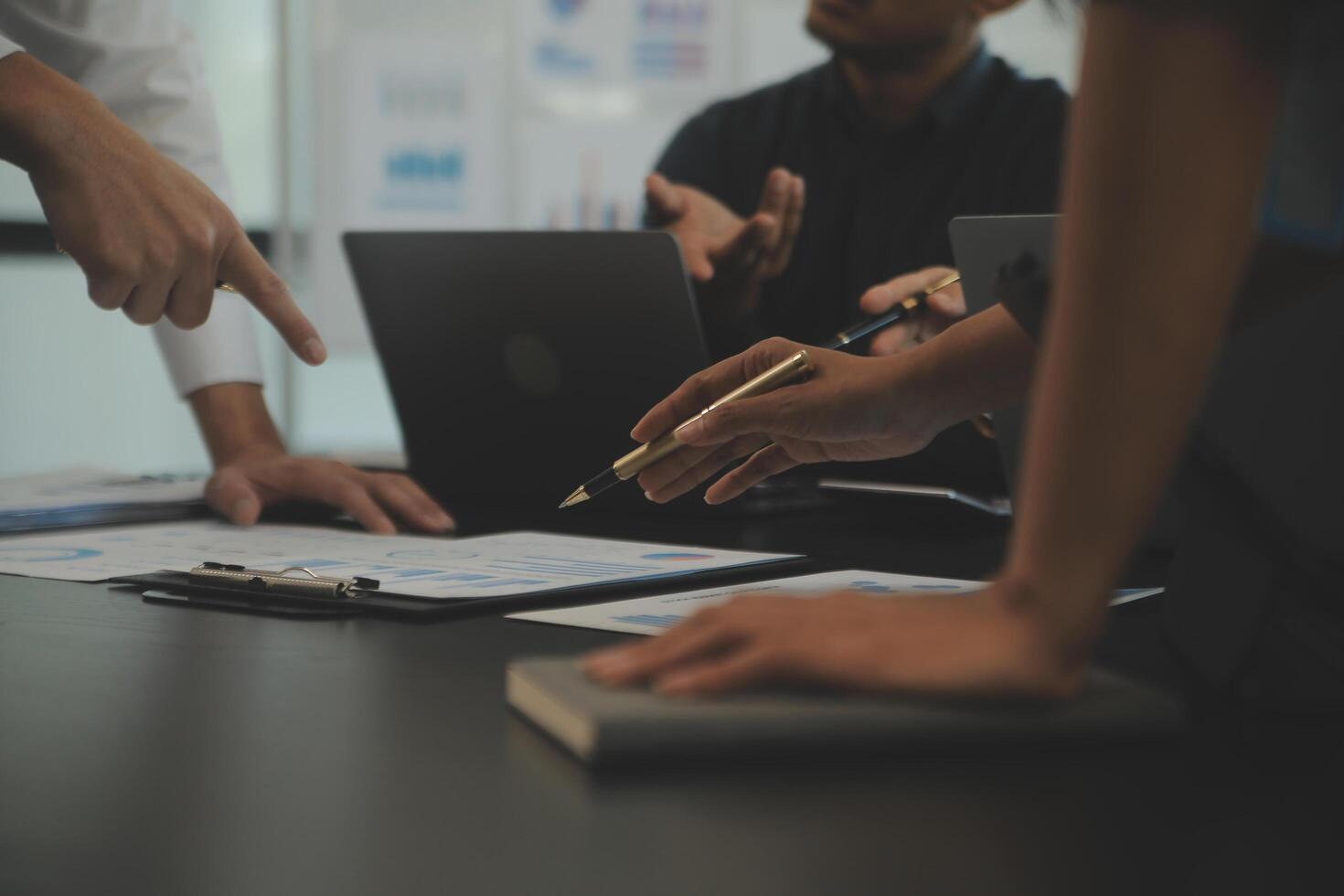 Business team collaboration discussing working analyzing with financial data and marketing growth report graph in team, presentation and brainstorming to strategy planning making profit of company. photo