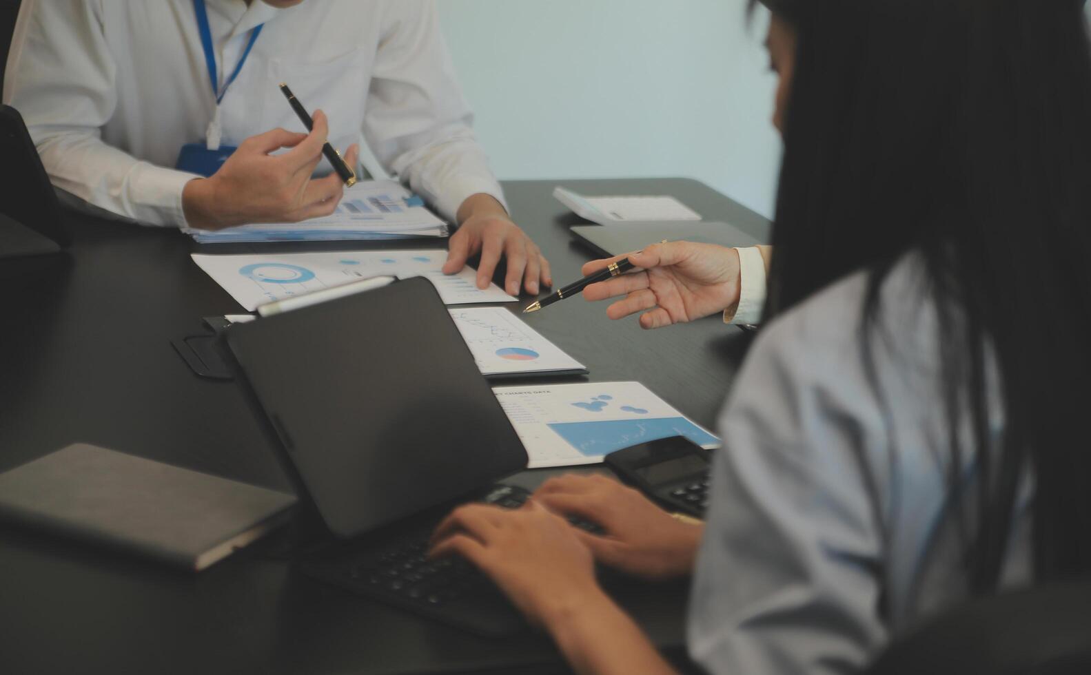 Business team collaboration discussing working analyzing with financial data and marketing growth report graph in team, presentation and brainstorming to strategy planning making profit of company. photo