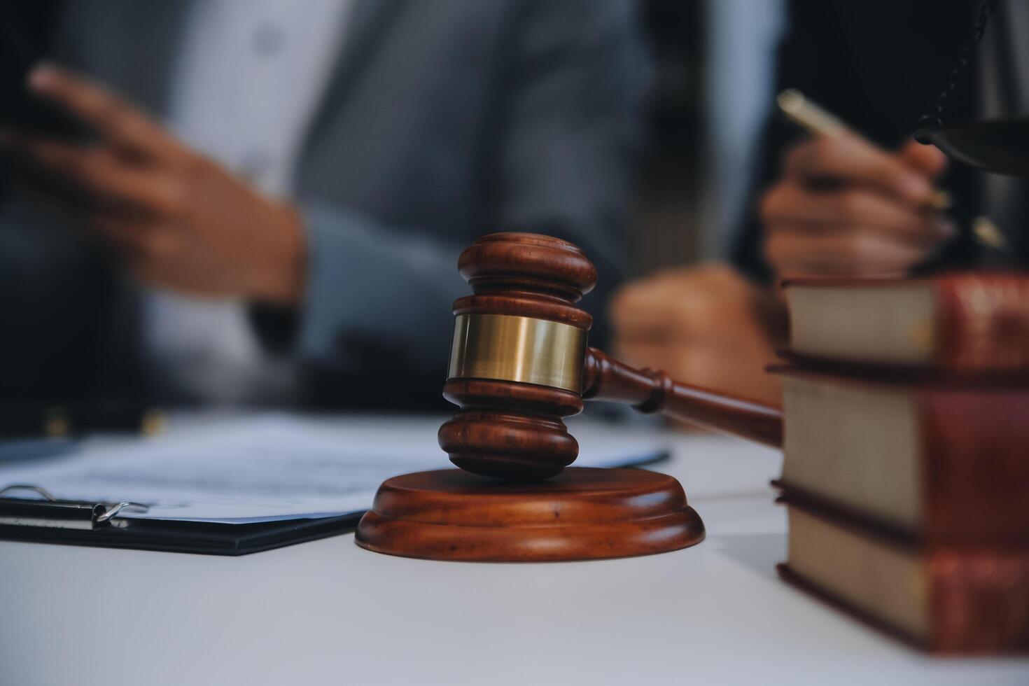 Consultation and conference of Male lawyers and professional businesswoman working and discussion having at law firm in office. Concepts of law, Judge gavel with scales of justice. photo
