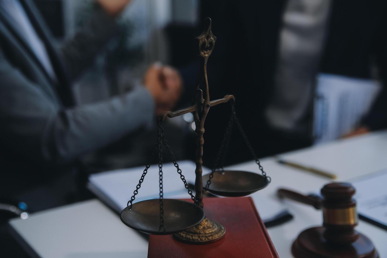 Consultation and conference of Male lawyers and professional businesswoman working and discussion having at law firm in office. Concepts of law, Judge gavel with scales of justice. photo