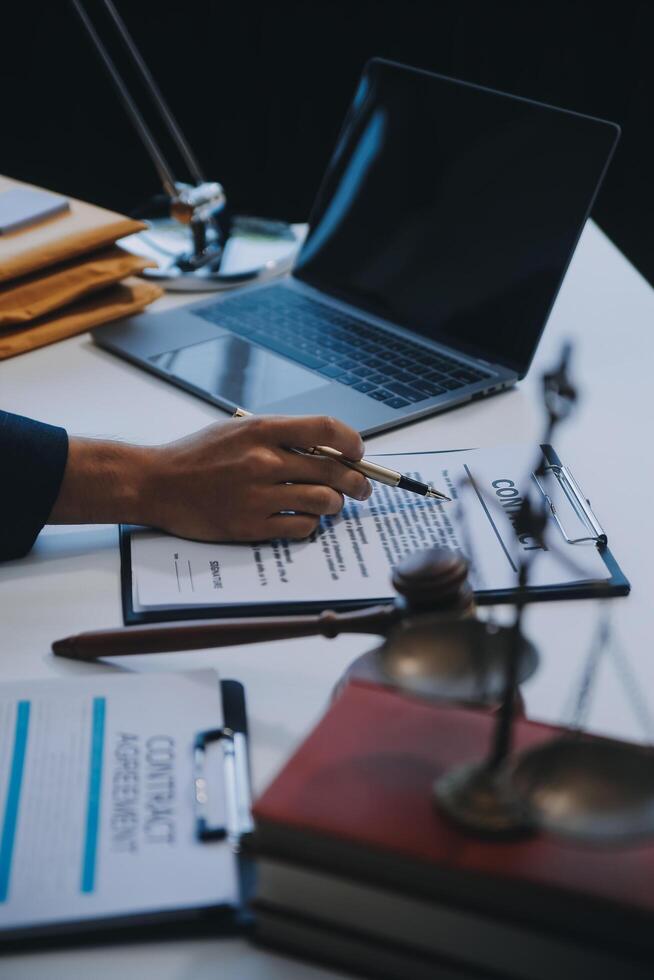 Consultation and conference of Male lawyers and professional businesswoman working and discussion having at law firm in office. Concepts of law, Judge gavel with scales of justice. photo