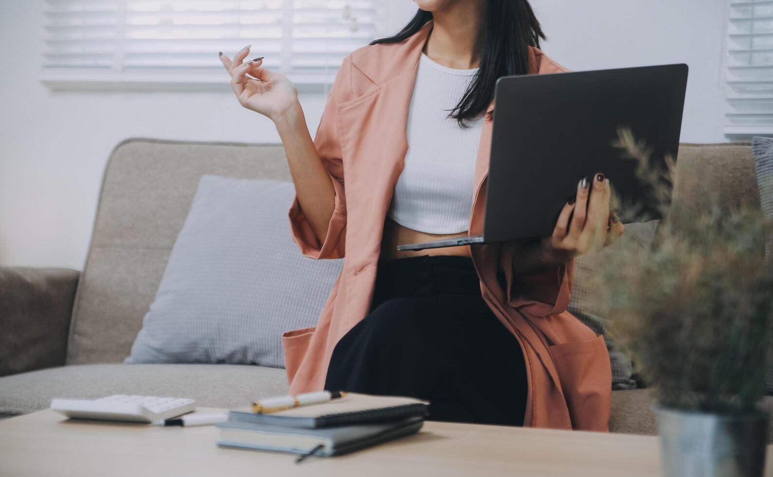 Asian woman working laptop. Business woman busy working on laptop computer at office. photo