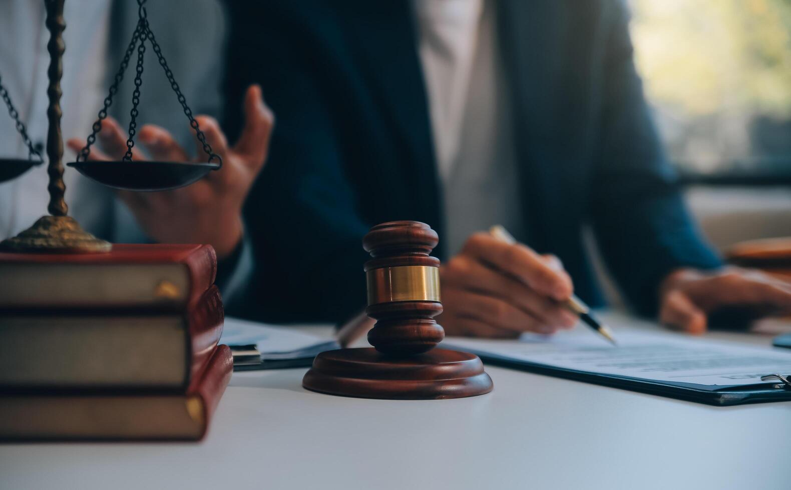 Consultation and conference of Male lawyers and professional businesswoman working and discussion having at law firm in office. Concepts of law, Judge gavel with scales of justice. photo