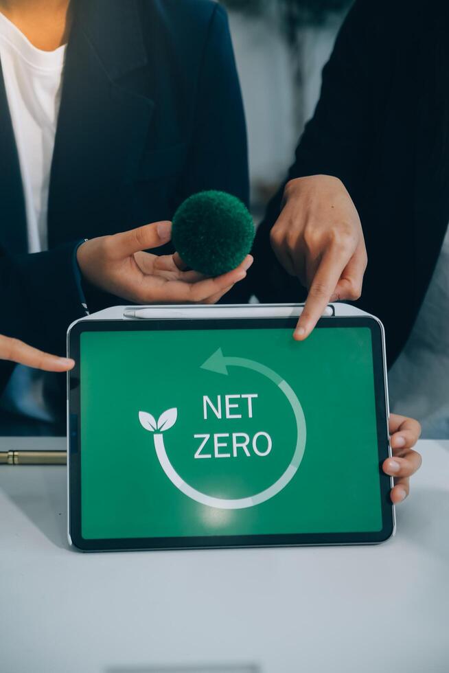 Carbon offset price report CO2 emission. Future growth Net zero waste in ESG ethical SME office protect climate change global warming social issues project. Group of asia people Eco friendly SDGs plan photo