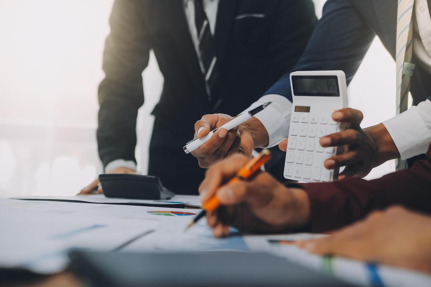 Business team working with new startup project plan and discussion information for financial strategy with laptop and digital tablet in a modern business lounge. photo
