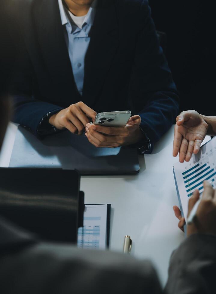 Business team working with new startup project plan and discussion information for financial strategy with laptop and digital tablet in a modern business lounge. photo