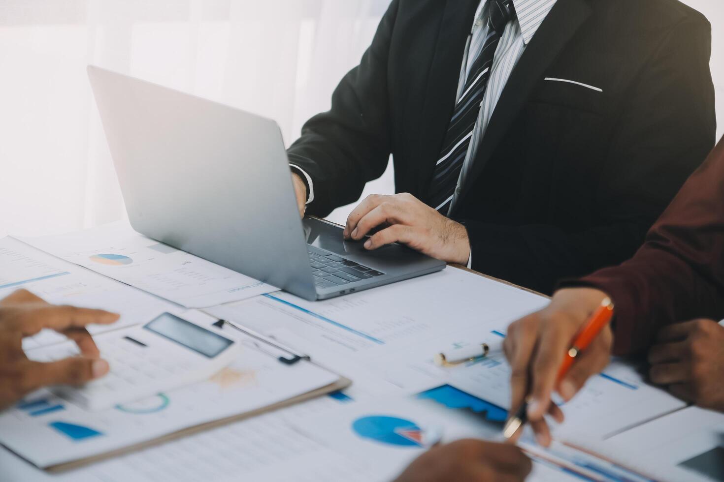 Business team collaboration discussing working analyzing with financial data and marketing growth report graph in team, presentation and brainstorming to strategy planning making profit of company. photo