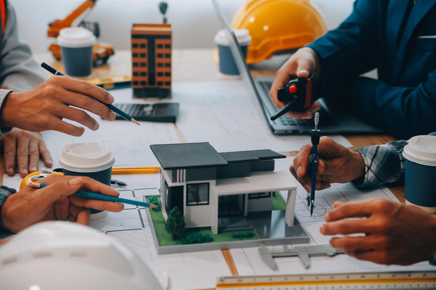 Image of engineer meeting for architectural project. working with partner and engineering tools on workplace vintage tone. photo