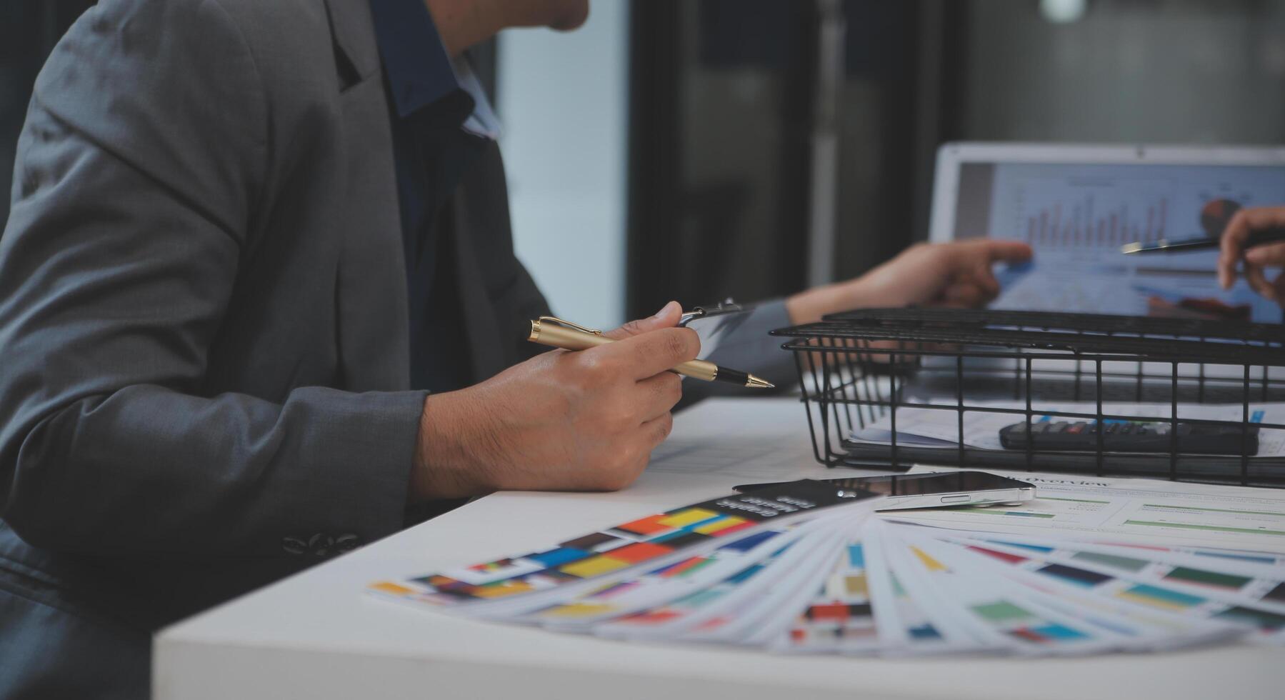 Close up ux developer and ui designer use augmented reality brainstorming about mobile app interface wireframe design on desk at modern office.Creative digital development agency photo