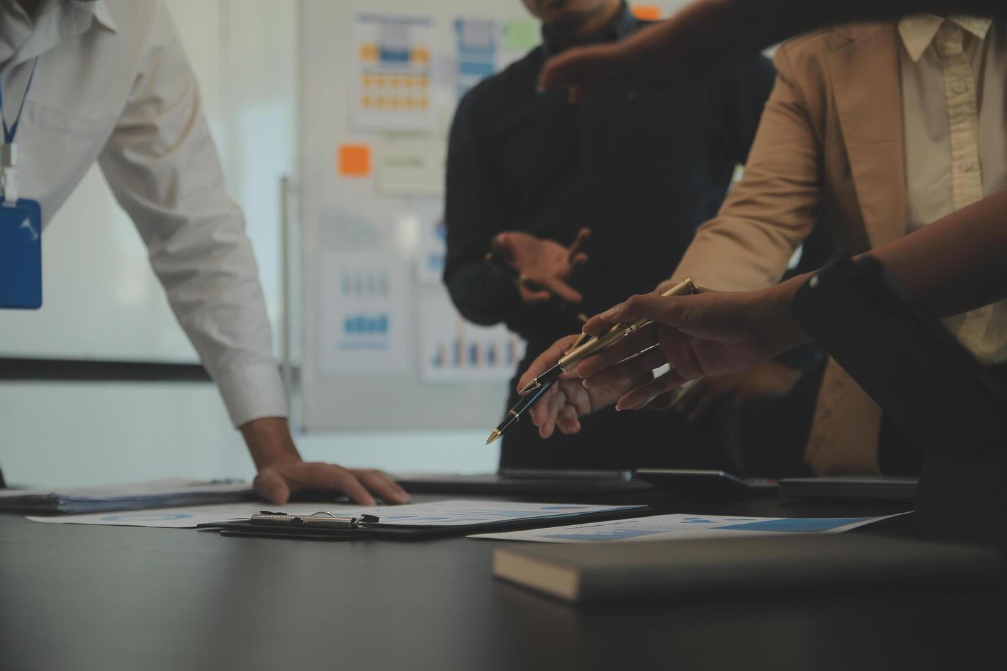 Business team collaboration discussing working analyzing with financial data and marketing growth report graph in team, presentation and brainstorming to strategy planning making profit of company. photo