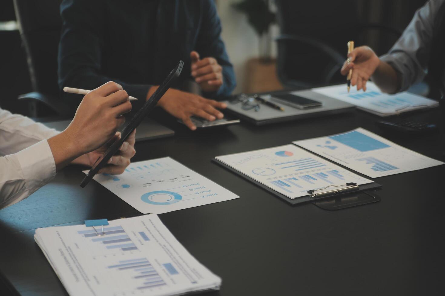 Business team collaboration discussing working analyzing with financial data and marketing growth report graph in team, presentation and brainstorming to strategy planning making profit of company. photo