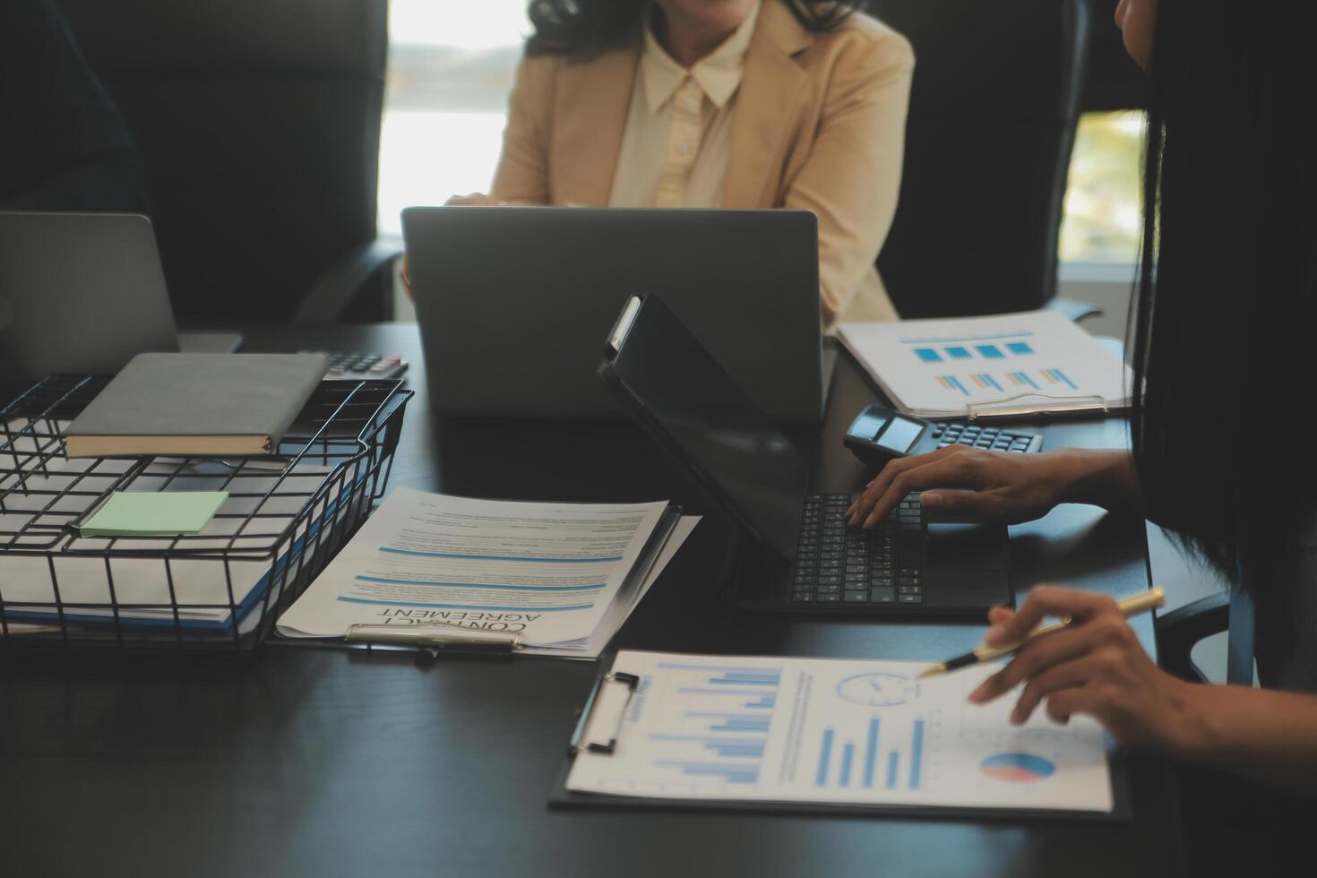 Business team collaboration discussing working analyzing with financial data and marketing growth report graph in team, presentation and brainstorming to strategy planning making profit of company. photo