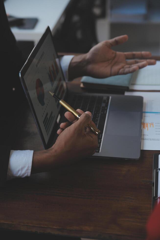 Finance manager meeting discussing company growth project success financial statistics, professional investor working start up project for strategy plan with document, laptop and digital tablet. photo