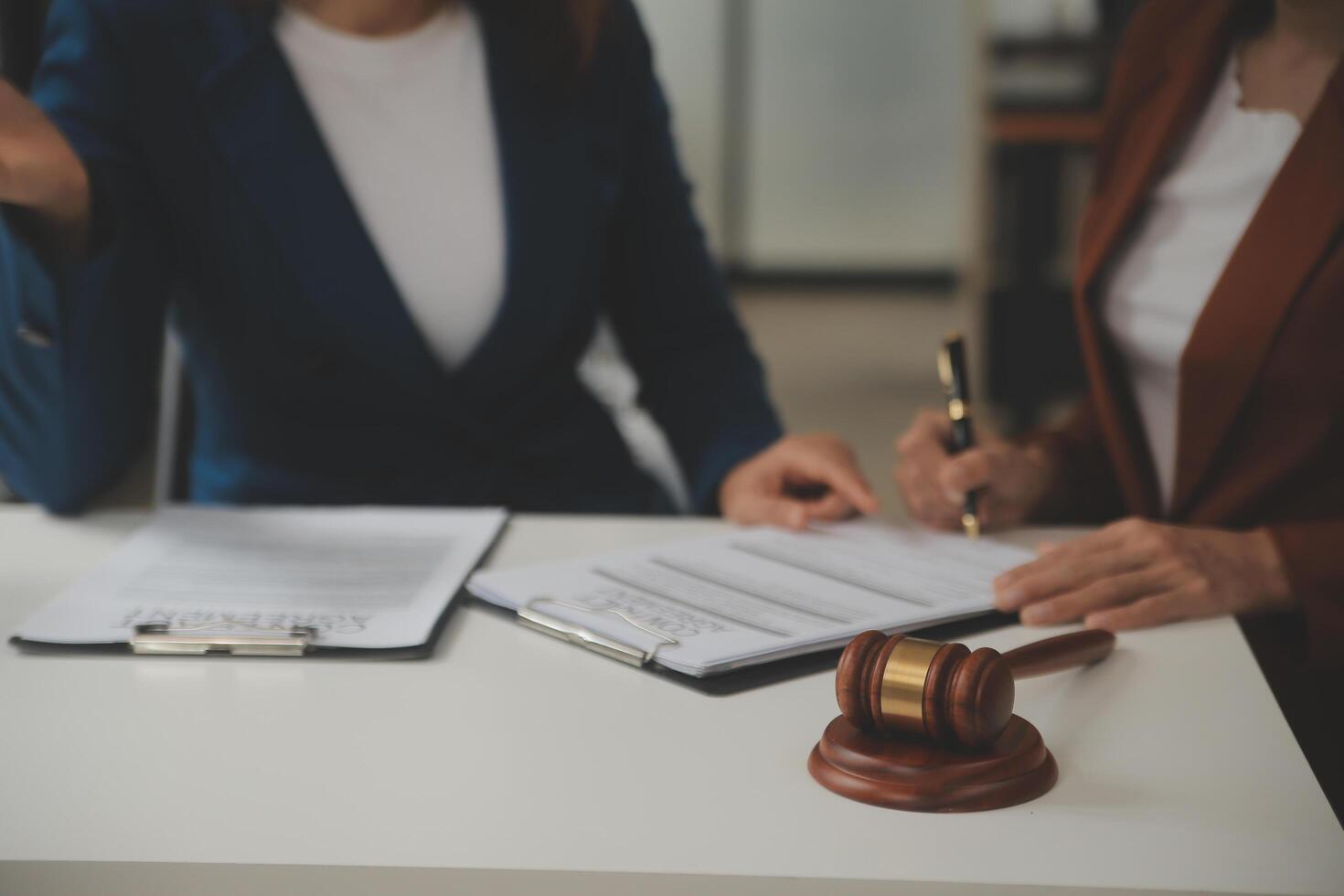 Lawyer, legal advisor, businessman brainstorming information on agreement details Business contracts in legal processing books for accuracy in contract documents. joint financial investment. photo