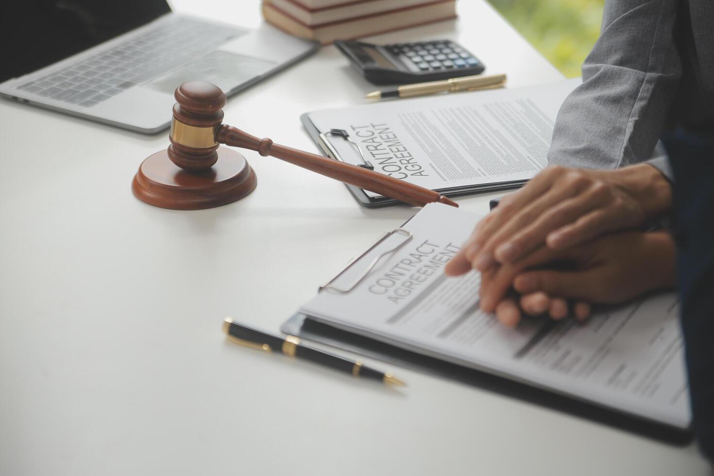 Lawyer, legal advisor, businessman brainstorming information on agreement details Business contracts in legal processing books for accuracy in contract documents. joint financial investment. photo