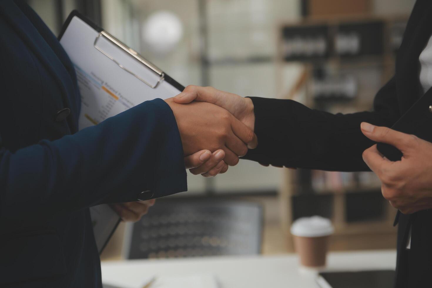 Business handshake for teamwork of business merger and acquisition,successful negotiate,hand shake,two businessman shake hand with partner to celebration partnership and business deal concept photo