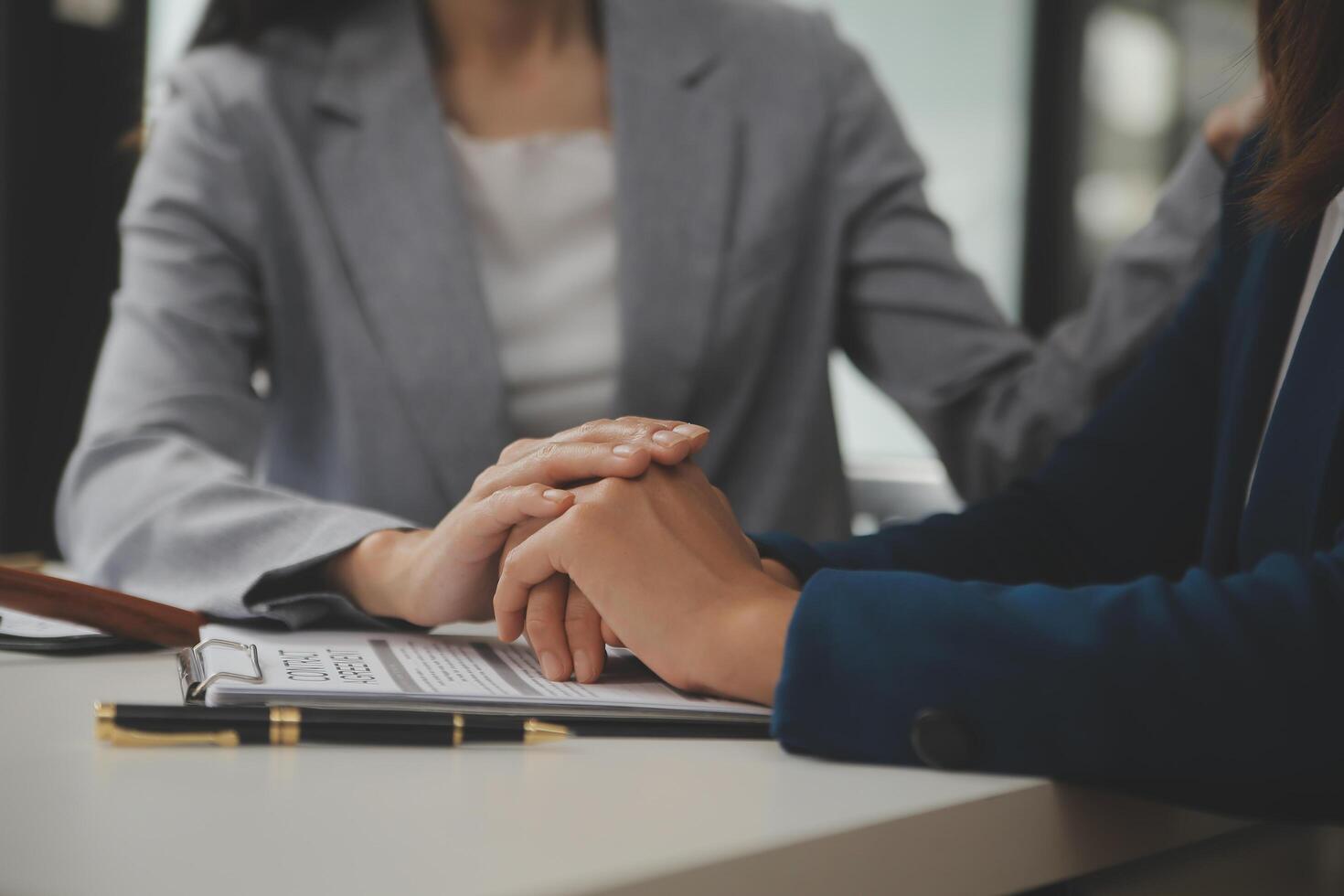 Lawyer, legal advisor, businessman brainstorming information on agreement details Business contracts in legal processing books for accuracy in contract documents. joint financial investment. photo