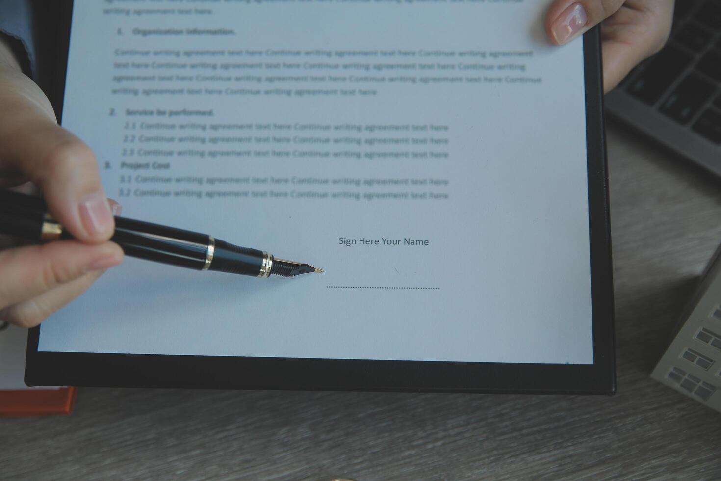 Real estate agent and customer signing contract to buy house, insurance or loan real estate.rent a house,get insurance or loan real estate or property. photo