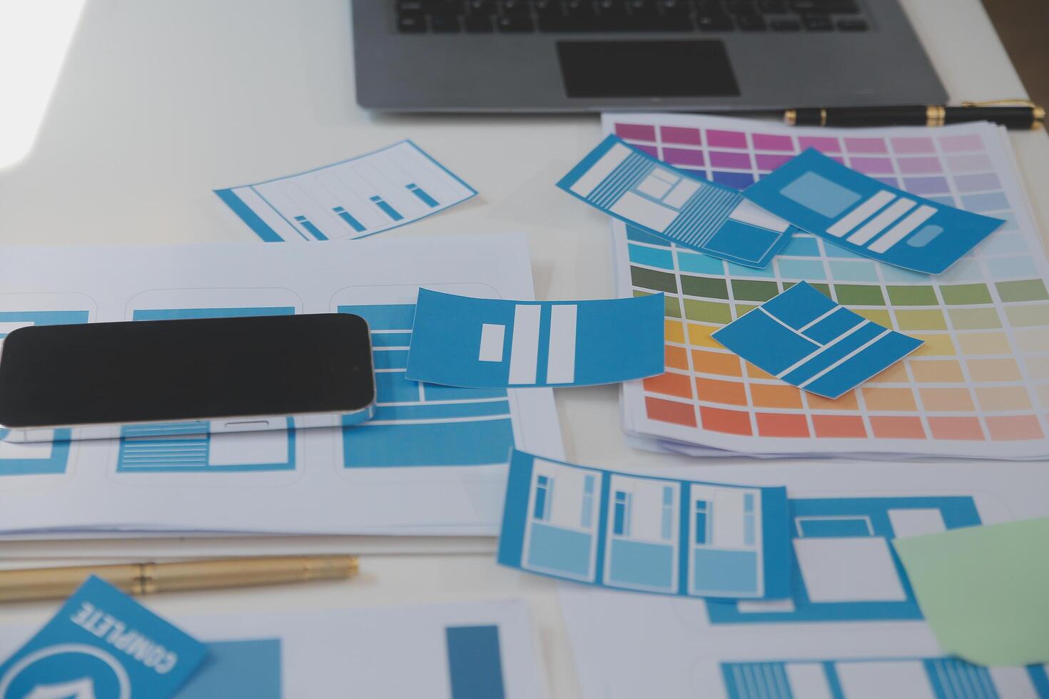 Close up ux developer and ui designer use augmented reality brainstorming about mobile app interface wireframe design on desk at modern office.Creative digital development agency photo