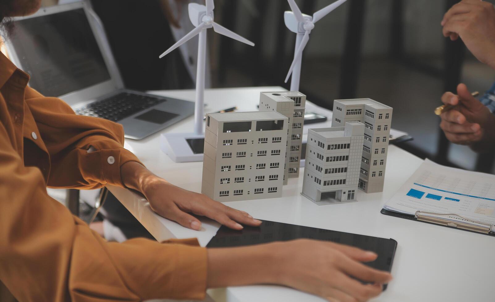 Electrical engineer with businessman discussing new project installation solar cell panel on the roof of building. Alternative energy concept. photo