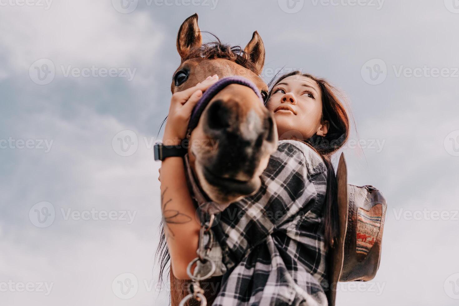 Young happy woman with her horse in evening sunset light. Outdoor photography with fashion model girl. Lifestyle mood. oncept of outdoor riding, sports and recreation. photo