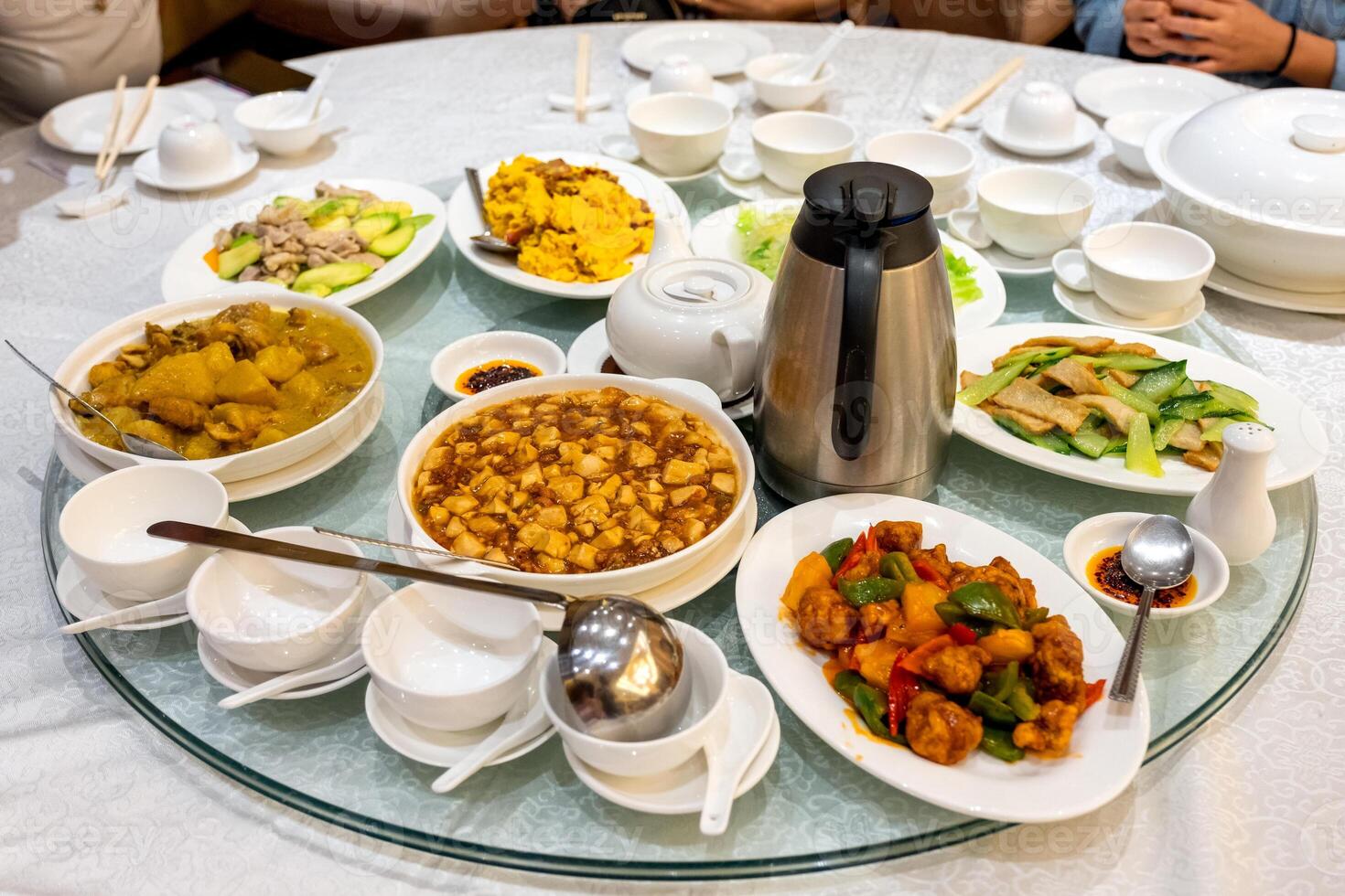 Variety asian food serving with tea preparing on glass round table photo