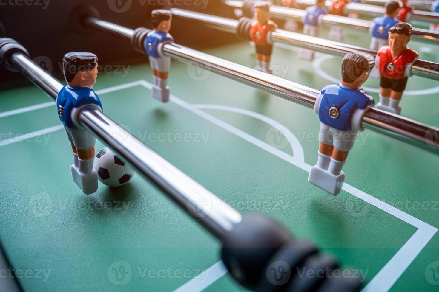 Close-up of Table football soccer game on green field photo