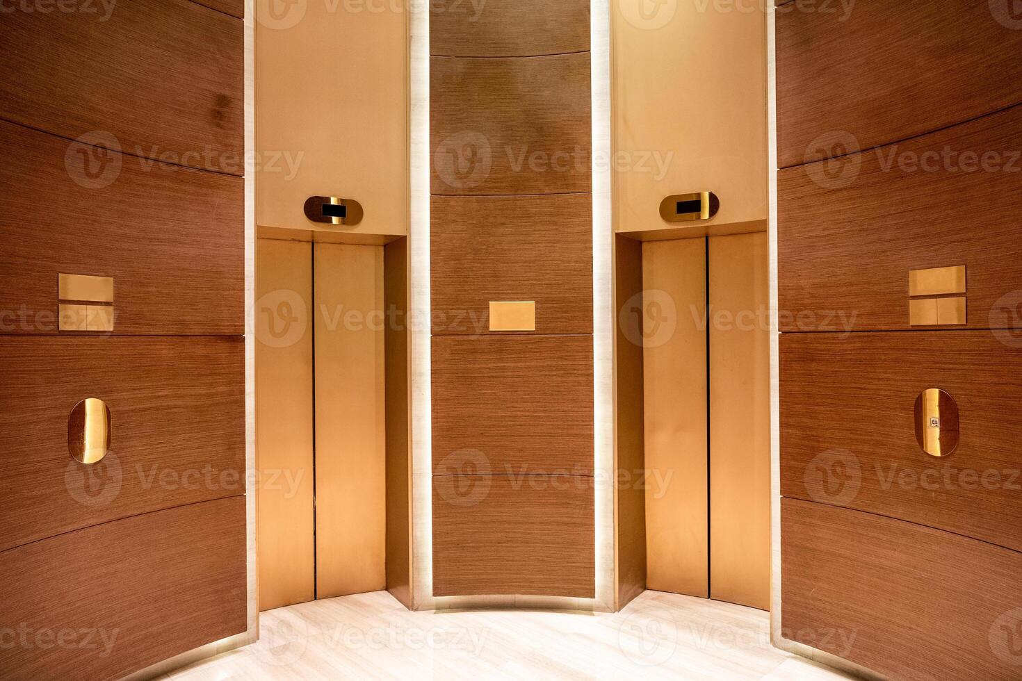 Closed elevator doors. Contemporary interior wooden curve photo