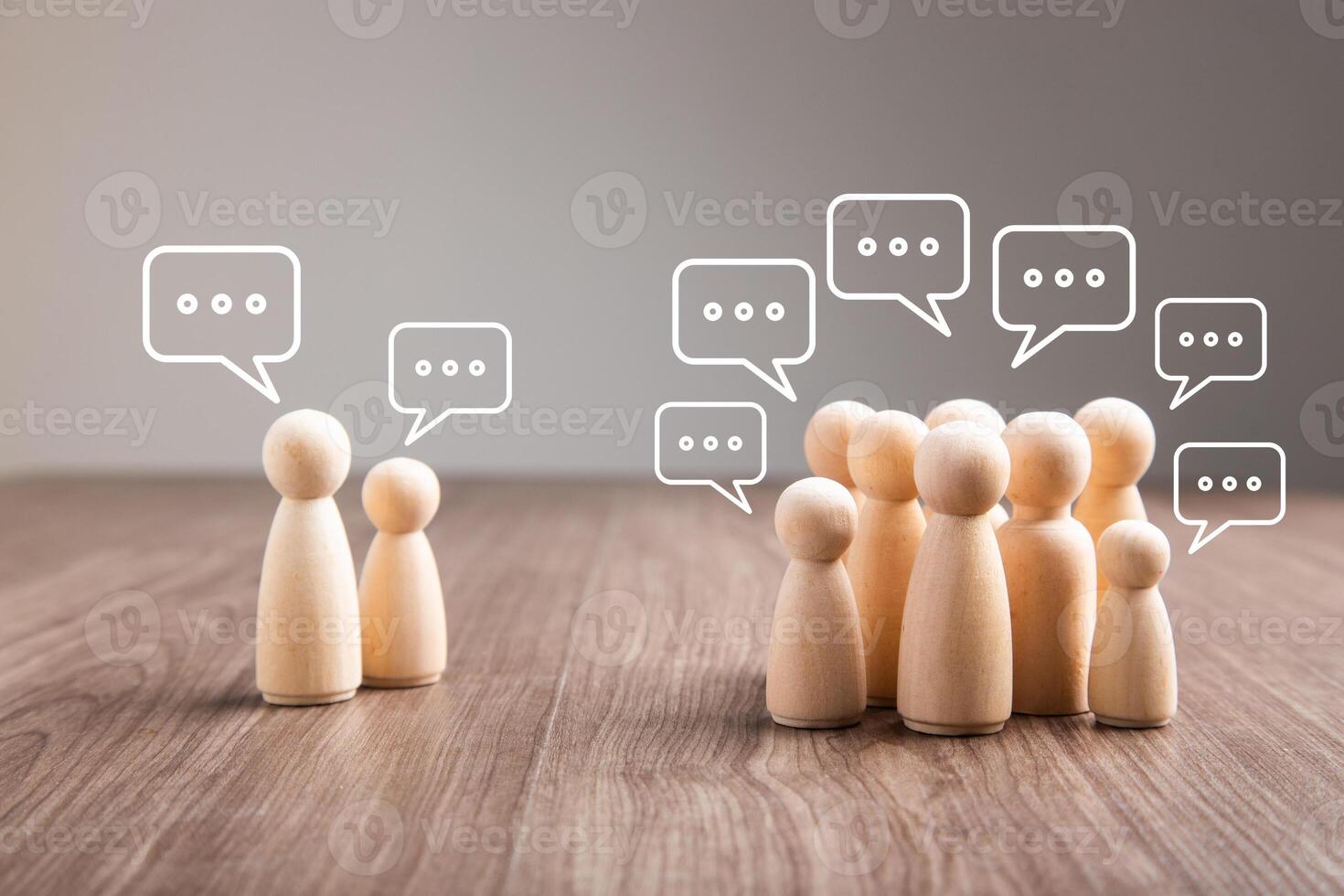 Wooden figurine with speech bubble. Mingle, discussion, chatting concept photo