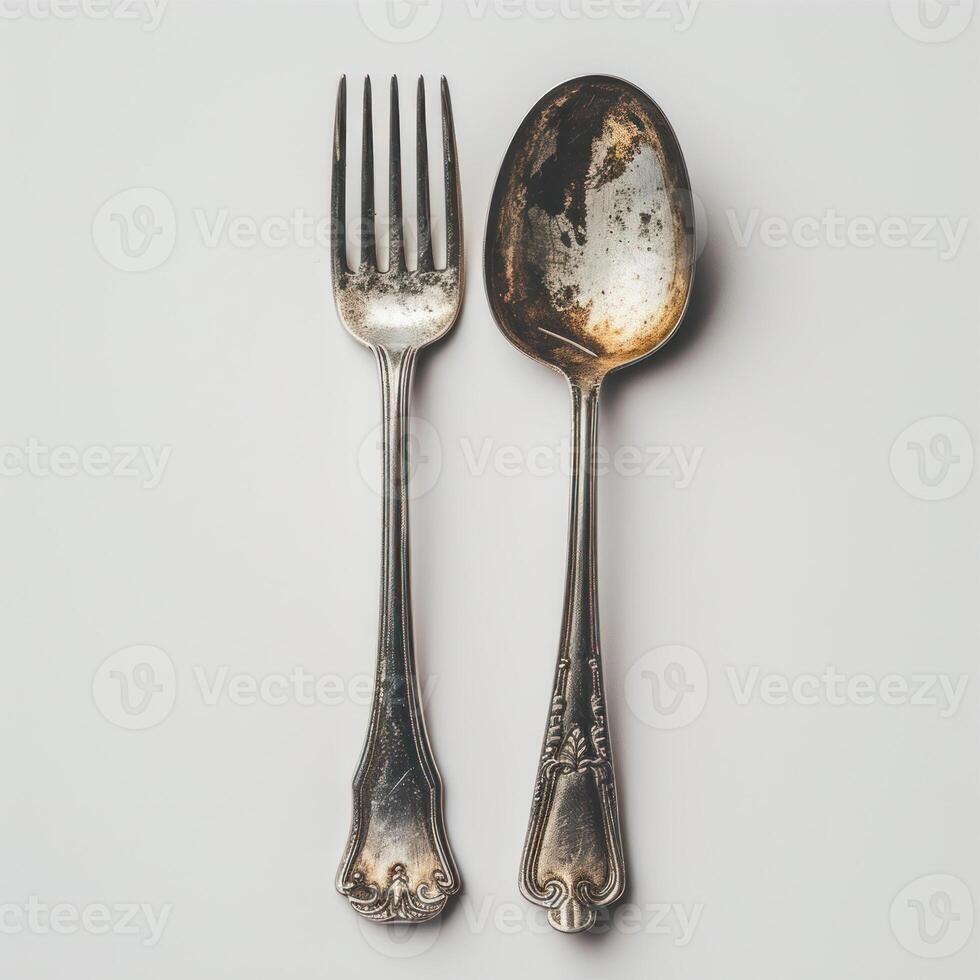 AI generated Vintage silver spoon and fork isolated on white background, top view photo