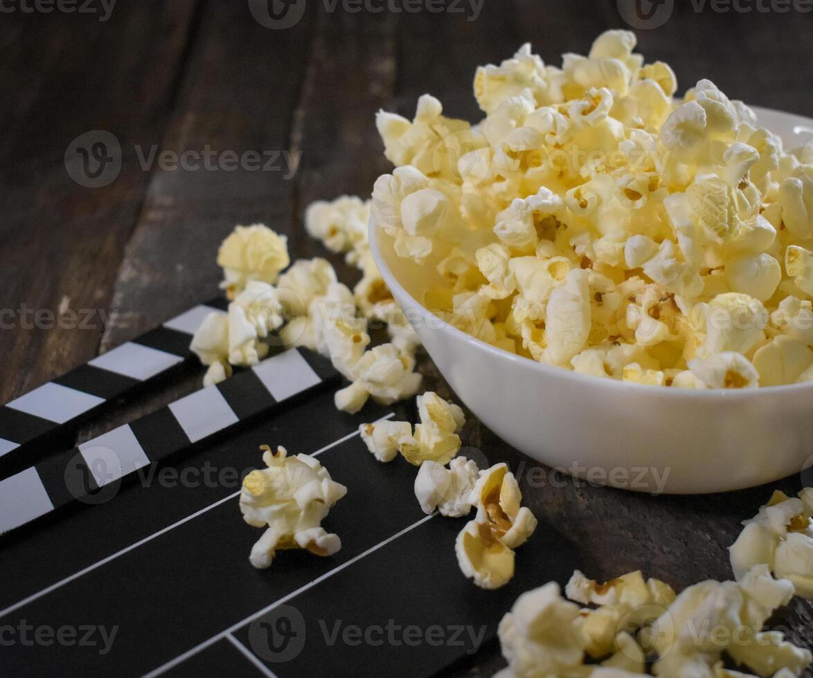 Popcorn on a wooden background photo