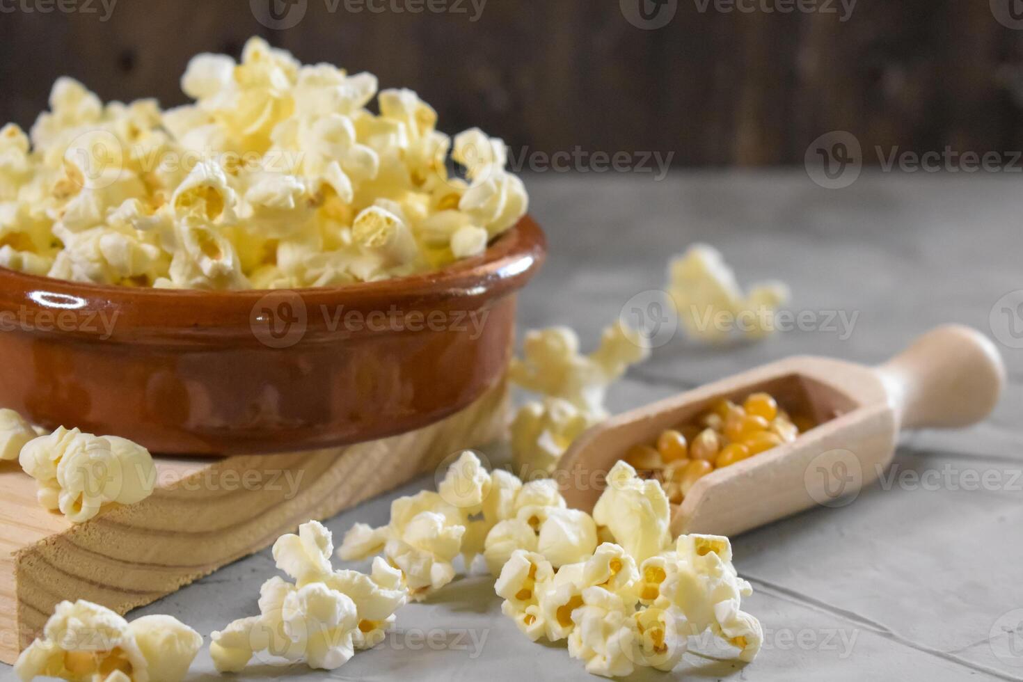 Popcorn on a wooden background photo