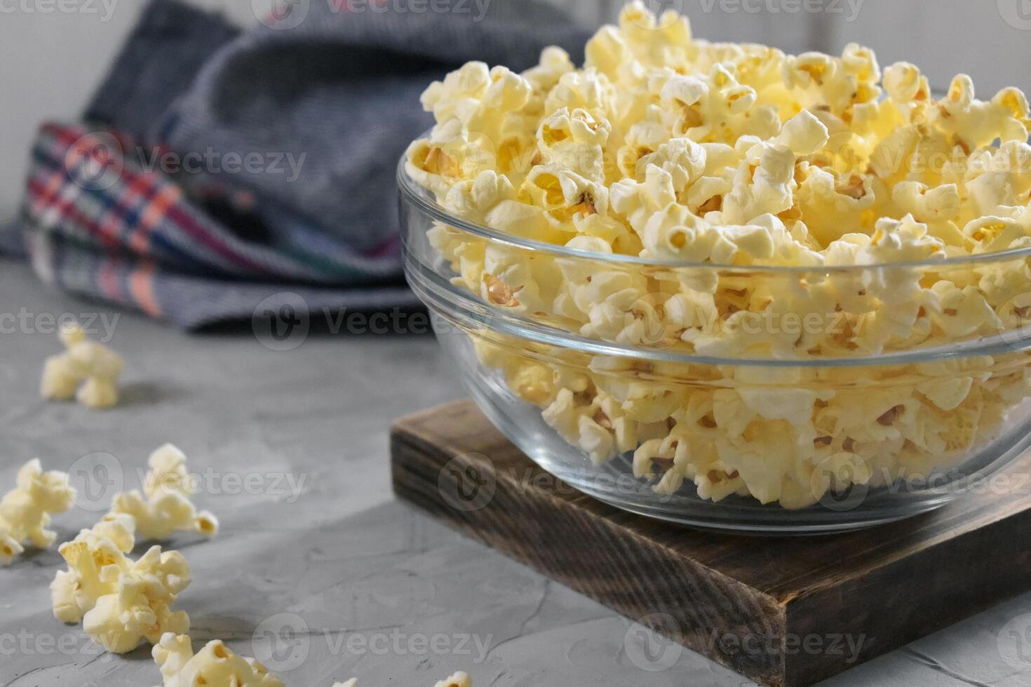 Popcorn on a wooden background photo