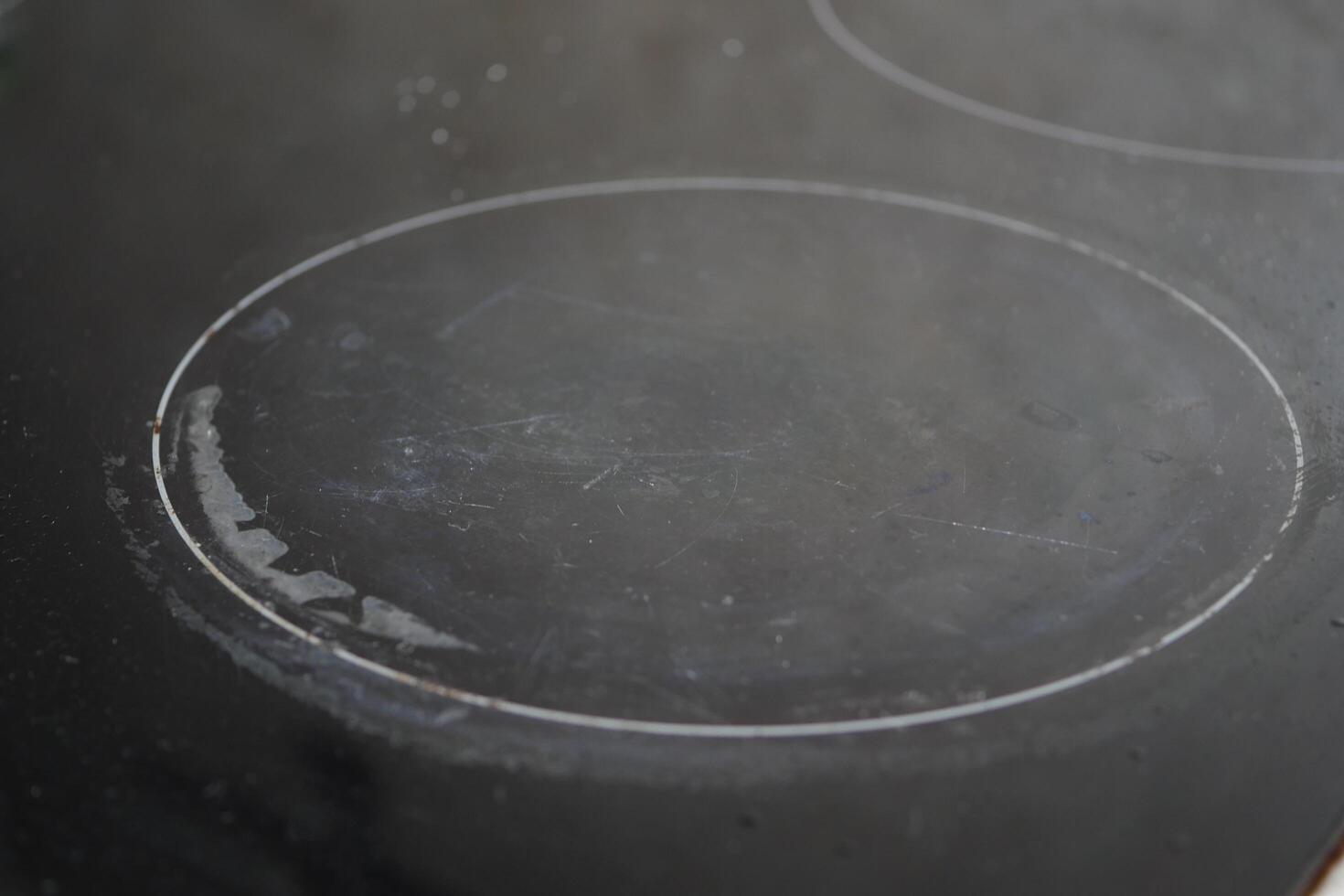 A black dirty electric stove. closeup . photo