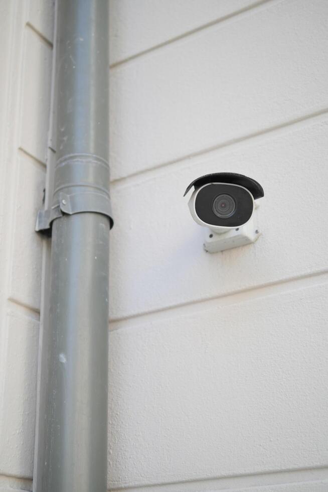 CCTV security camera operating outdoor photo