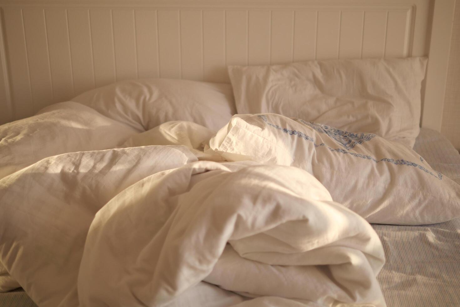 messy bed in early morning , messy bed after waking up photo