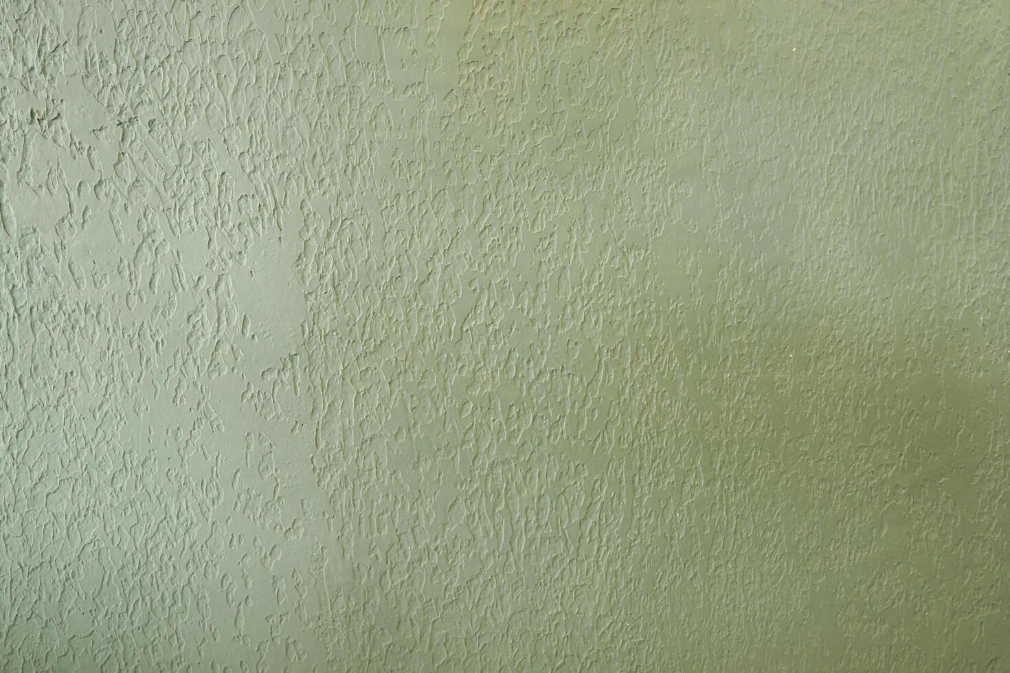 green wall texture colored rusty plaster background backdrop . photo