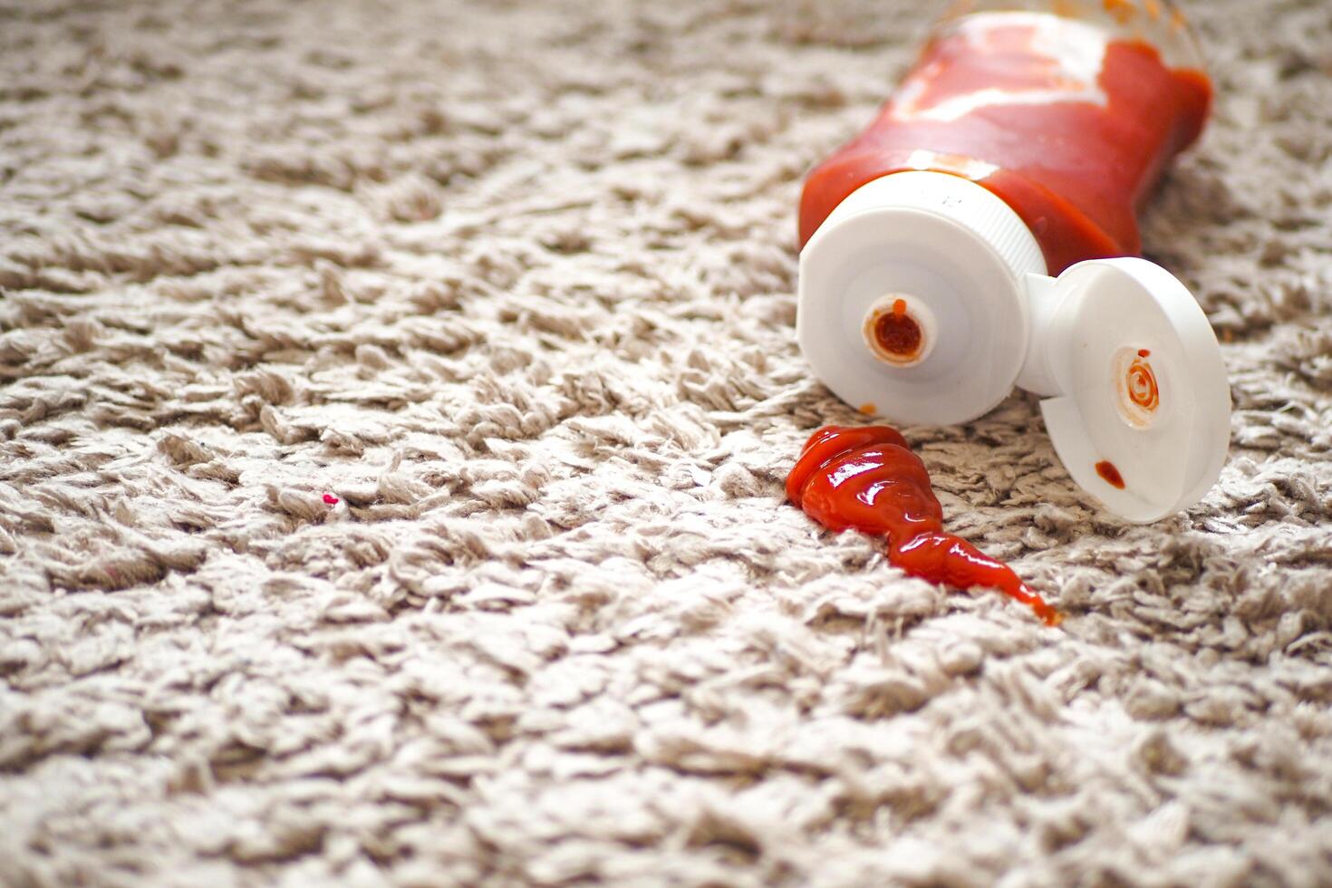 Tomato stain on a carpet indoors, photo