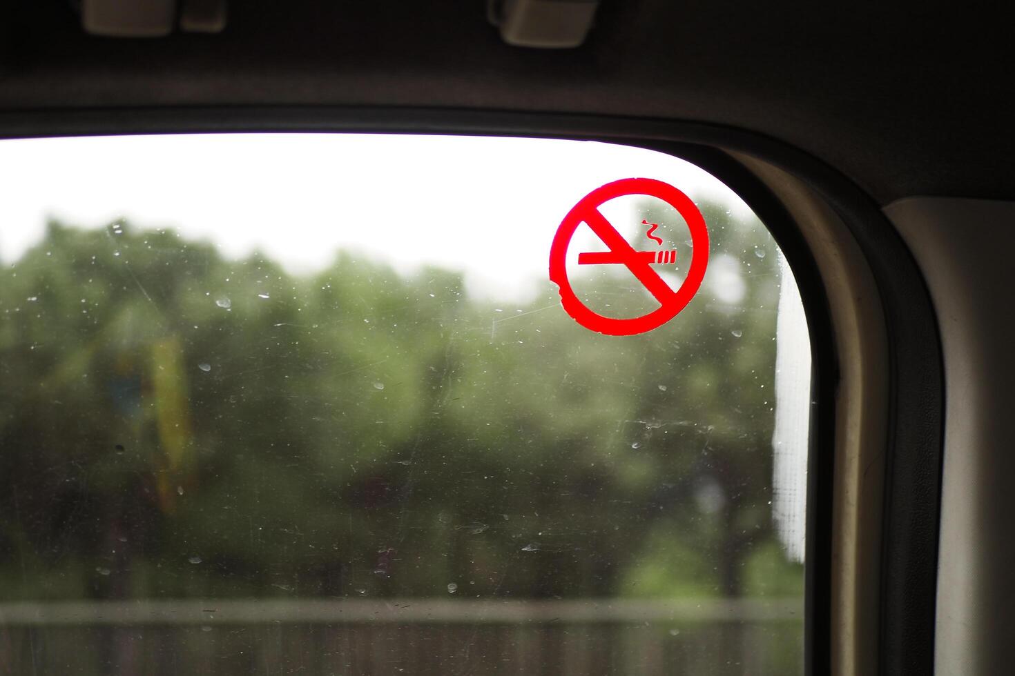 No smoke sign on car window photo