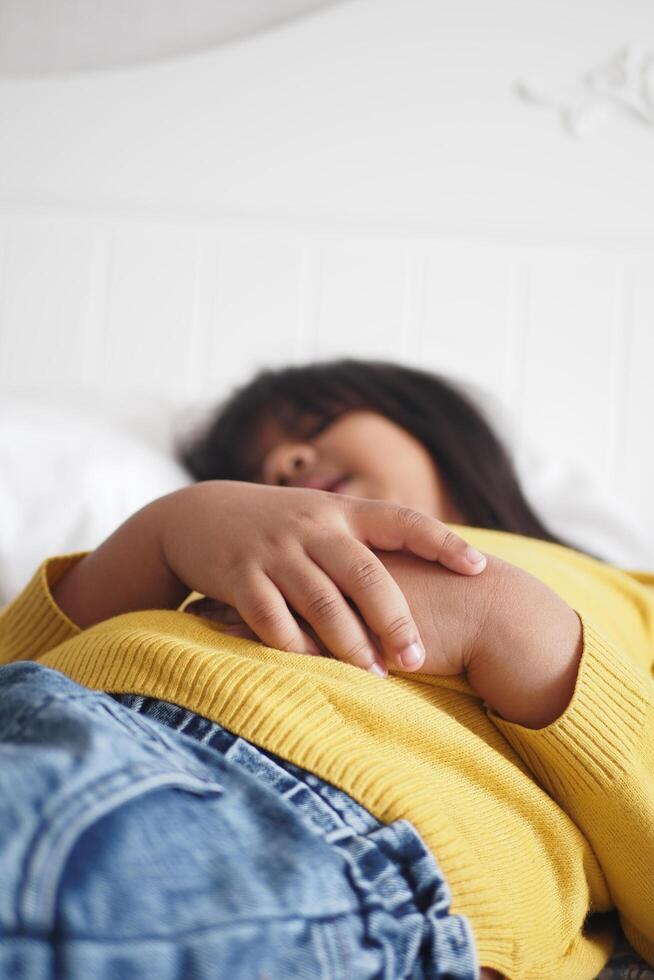 a child sleeping in bed, selective focus . photo