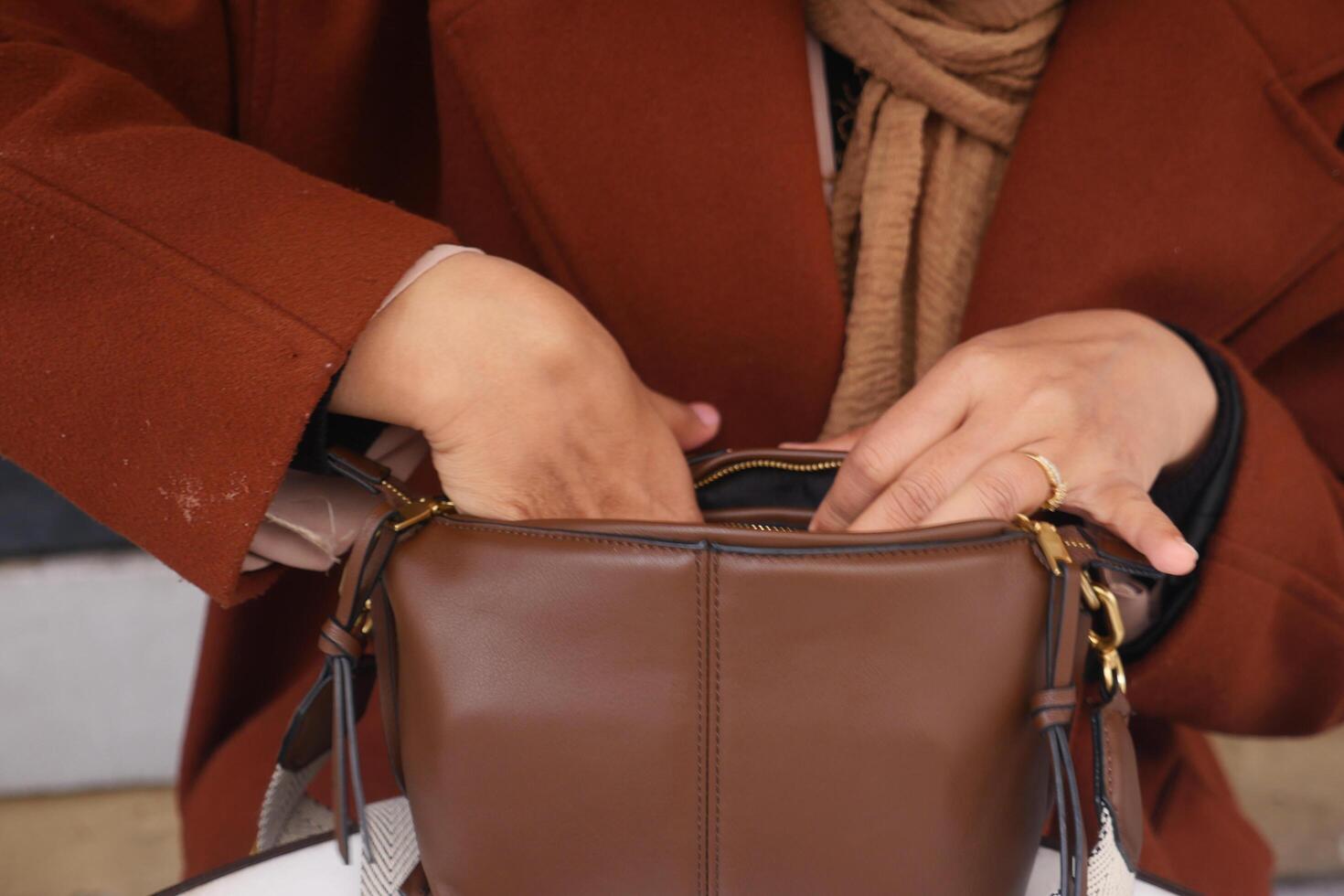 women looking for something in her purse photo