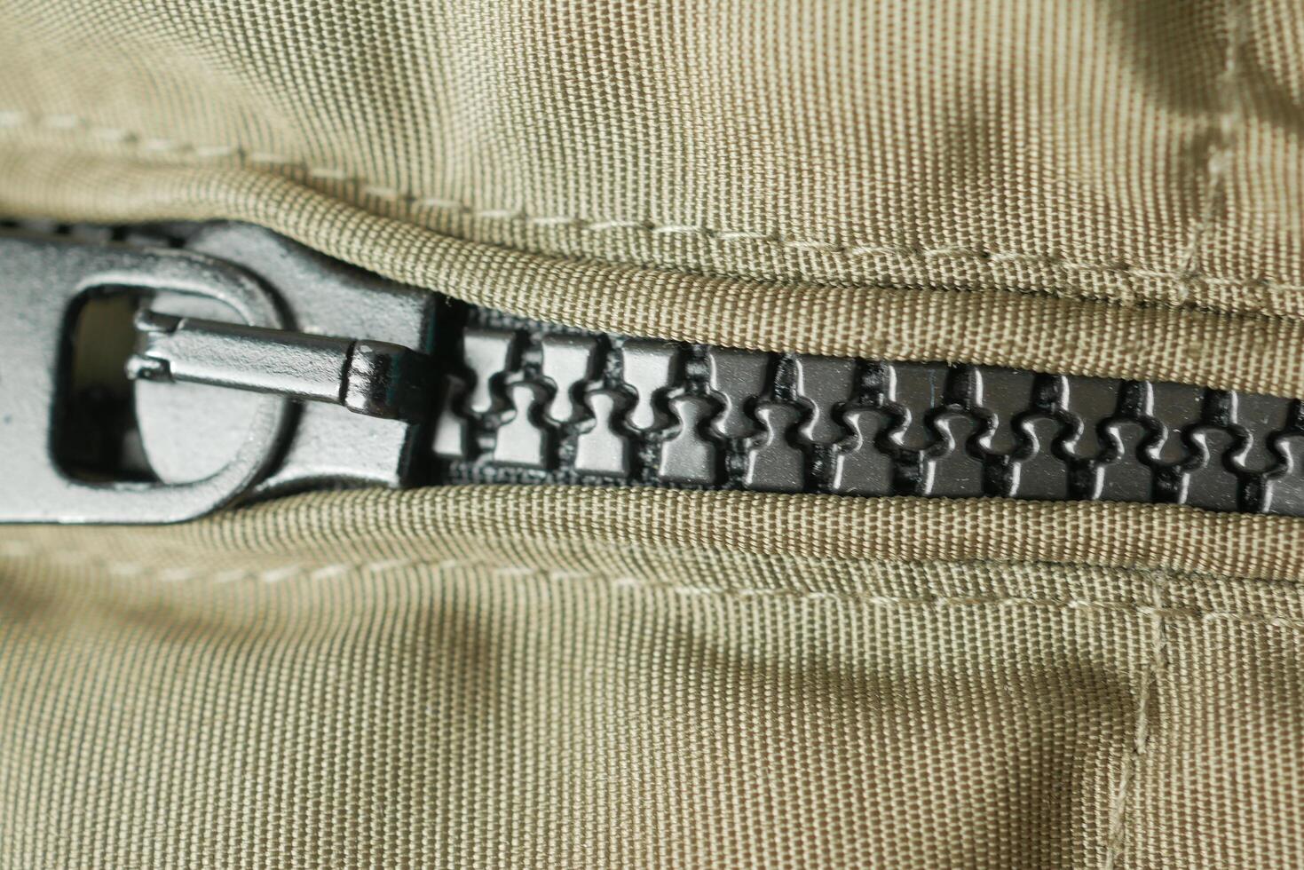Close-up of a zipper with a slider photo