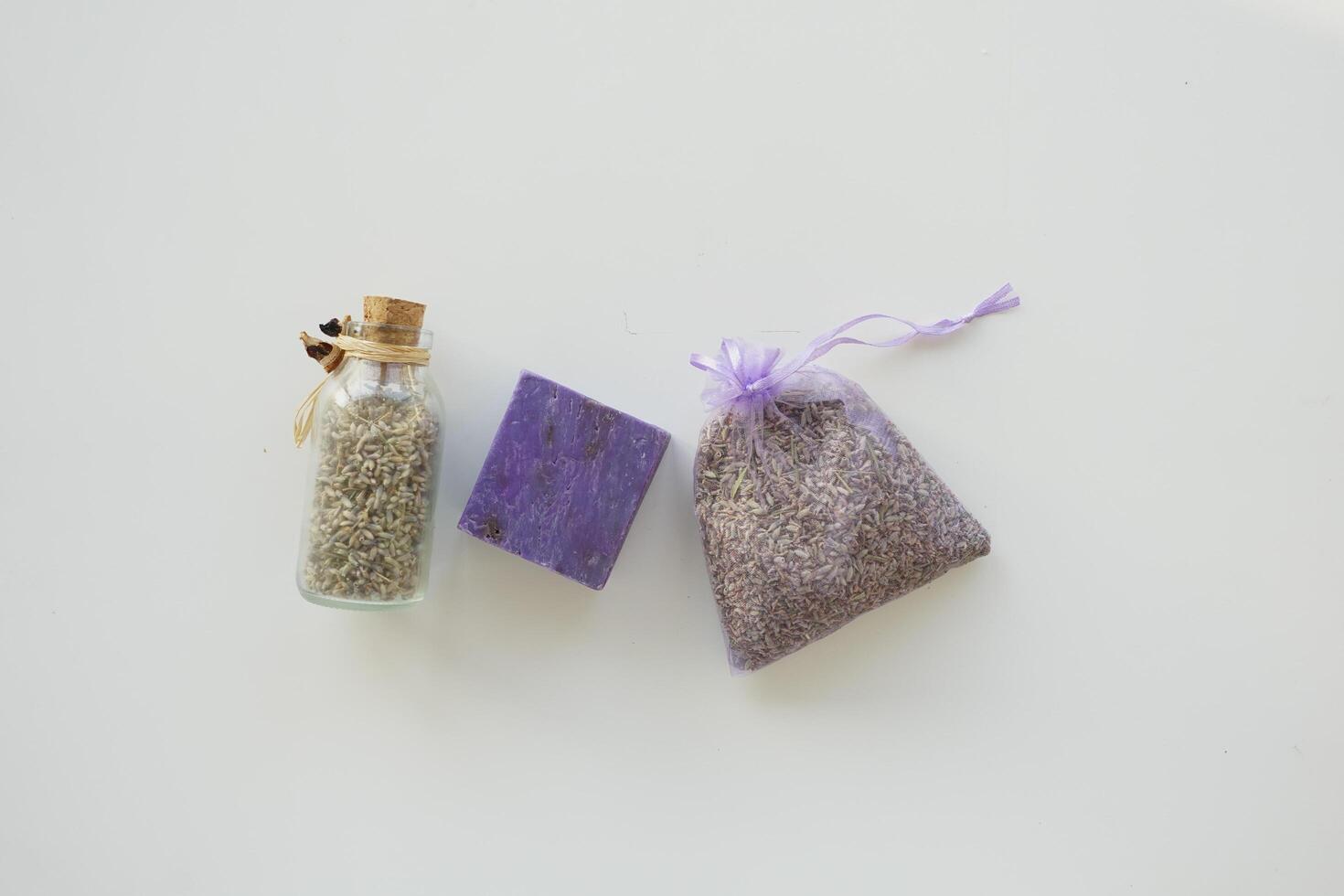 Homemade natural soap bar and lavender flower on table photo