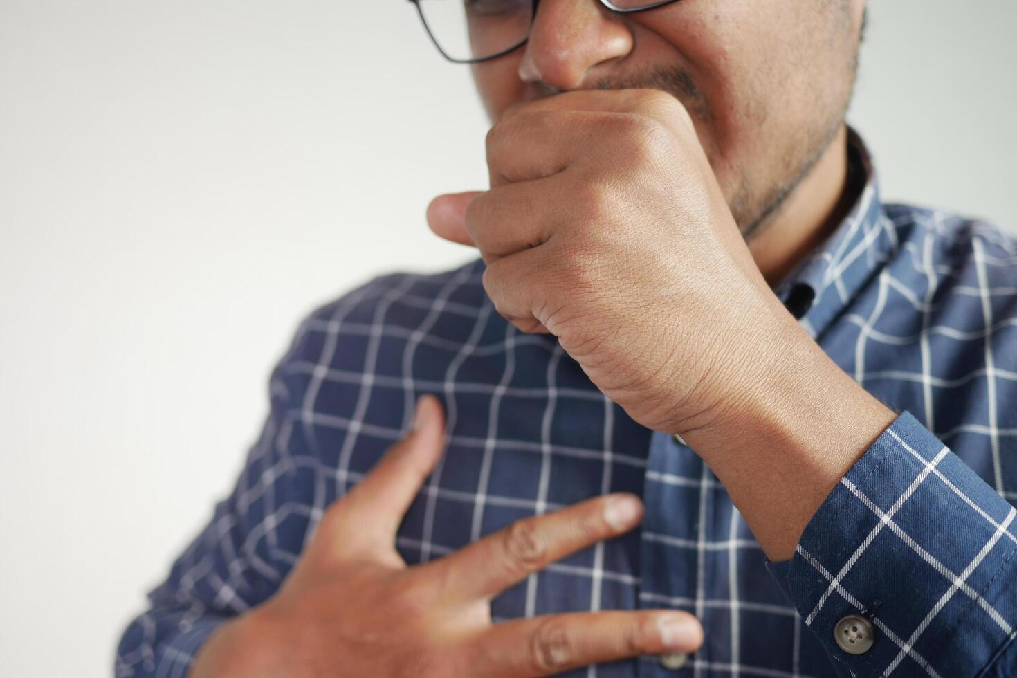 Sick man got flu allergy sneezing and blowing nose photo